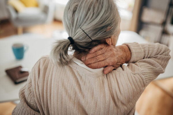 Old woman has neck problems