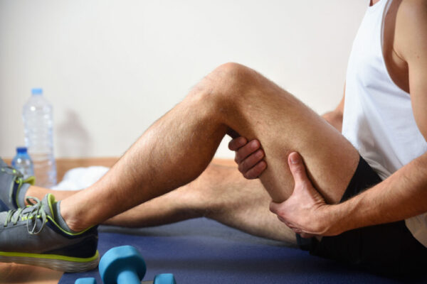 Detail of man doing sports with hamstrings pain